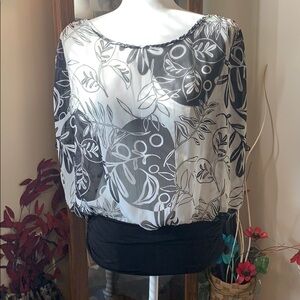 Sheer blouse by sushi flowers.